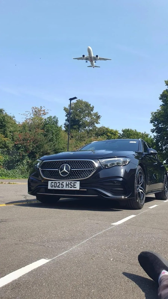 Professional airport transfer vehicle at an airport terminal, emphasizing reliability and comfort